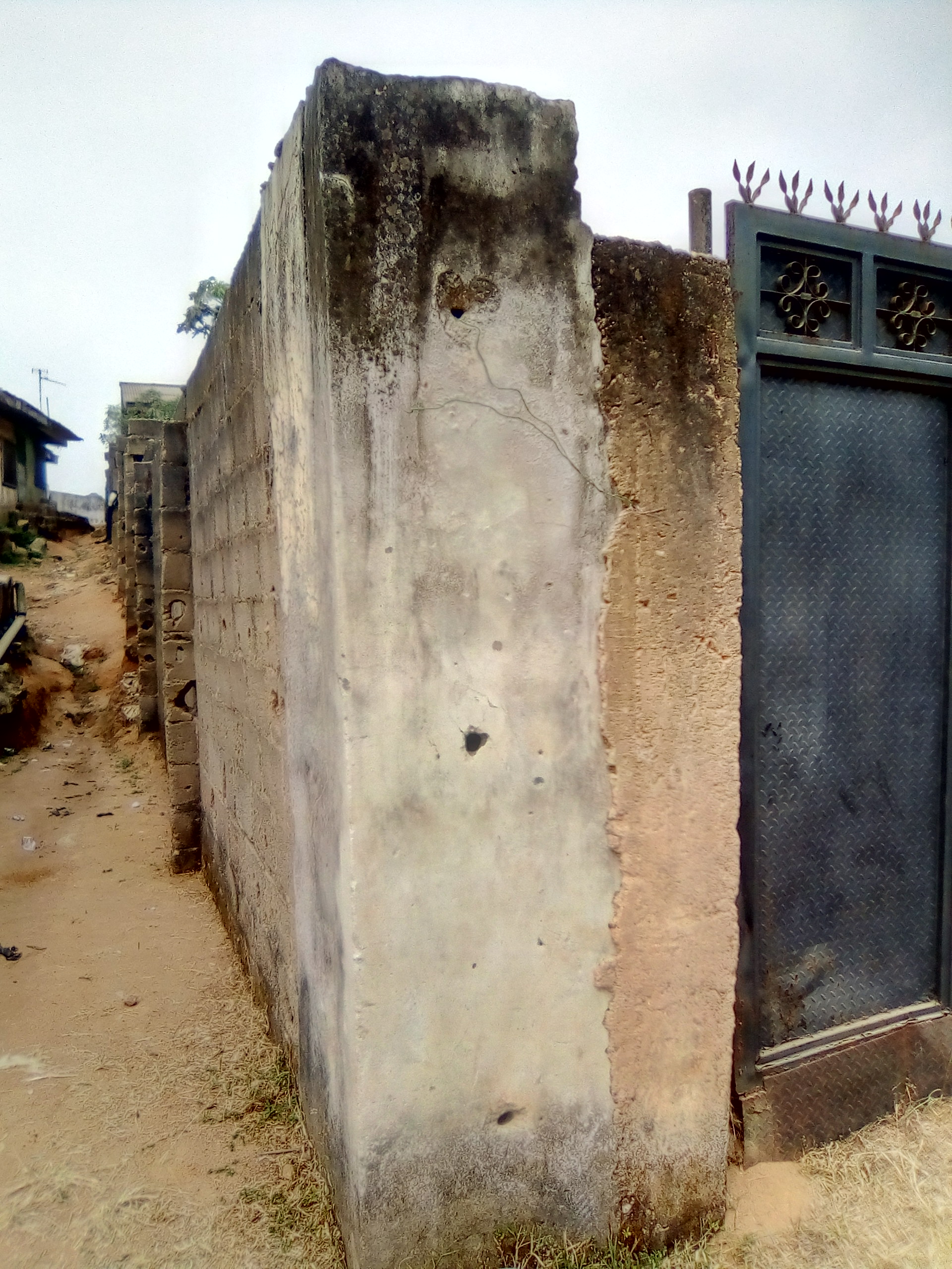 Uncompleted building on a full plot of land